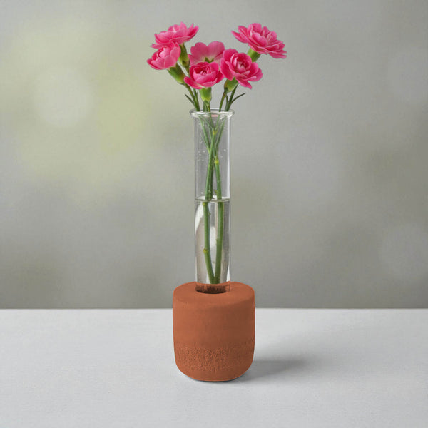 Burnt orange concrete test tube bud vase with pink flowers