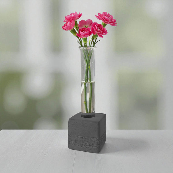 Black square concrete test tube bud vase with pink flowers